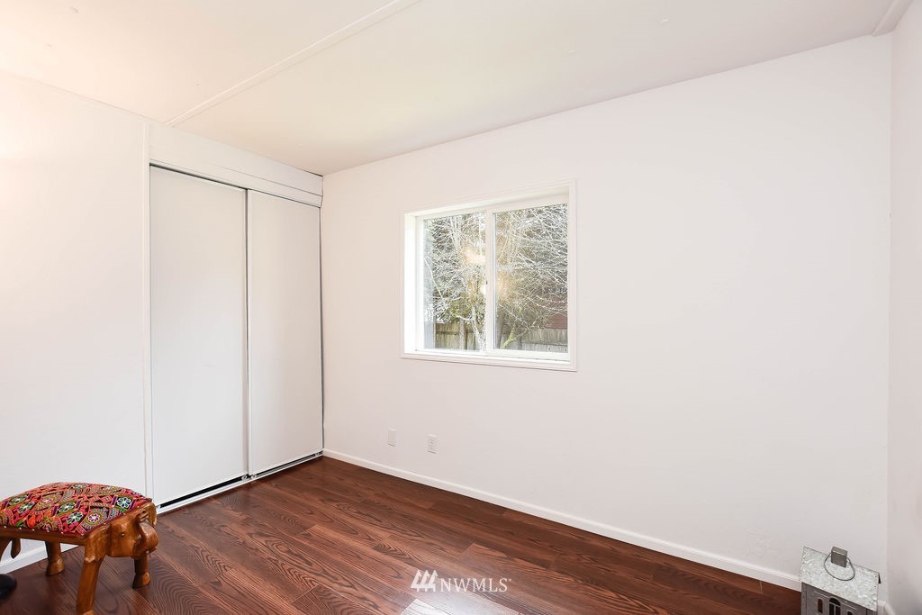 17920 Trombley Road Snohomish, WA 98290 - Photo 20 of 36 an empty room with wooden floor and windows
