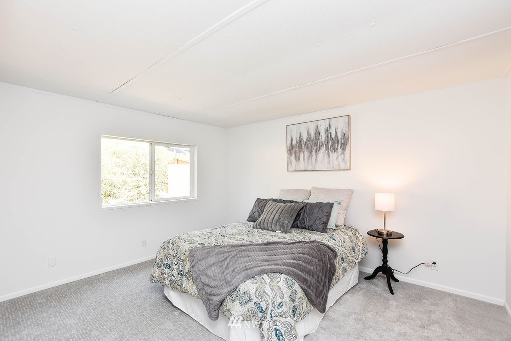 17920 Trombley Road Snohomish, WA 98290 - Photo 21 of 36 a bedroom with a bed and a window
