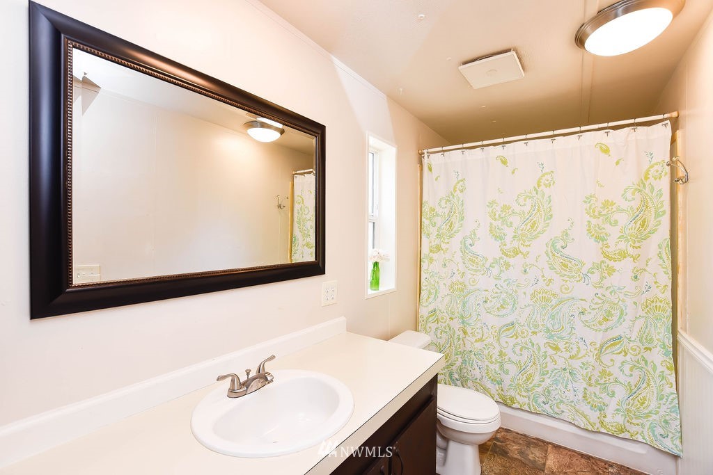 17920 Trombley Road Snohomish, WA 98290 - Photo 23 of 36 a bathroom with a sink and a mirror