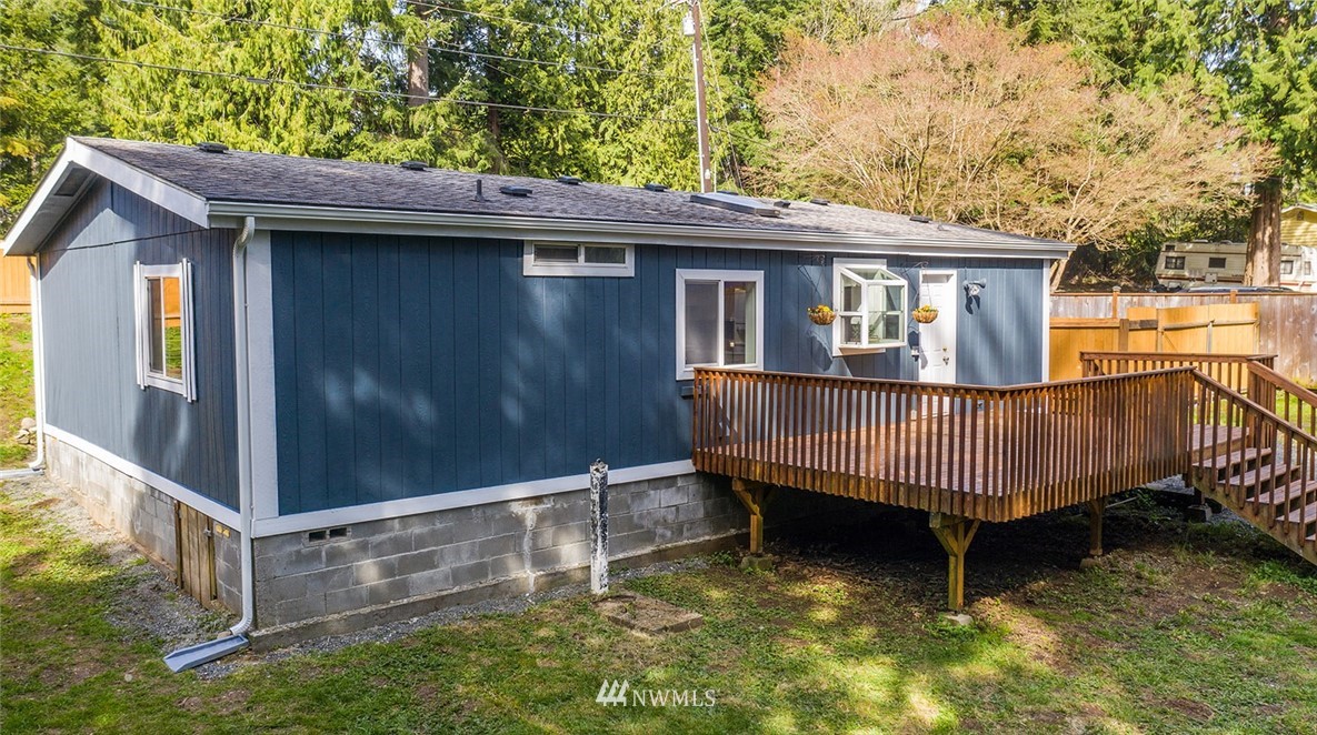 17920 Trombley Road Snohomish, WA 98290 - Photo 29 of 36 a backyard of a house with large trees and wooden fence