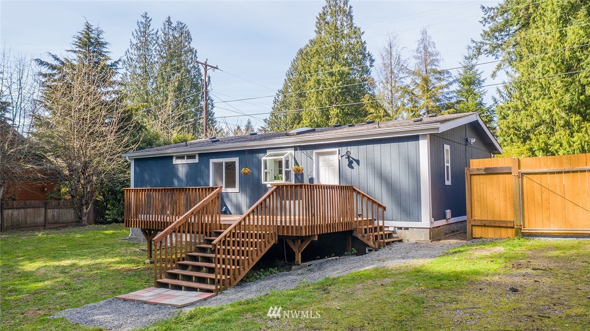 17920 Trombley Road Snohomish, WA 98290 - Photo 30 of 36 a view of backyard with a garden and deck