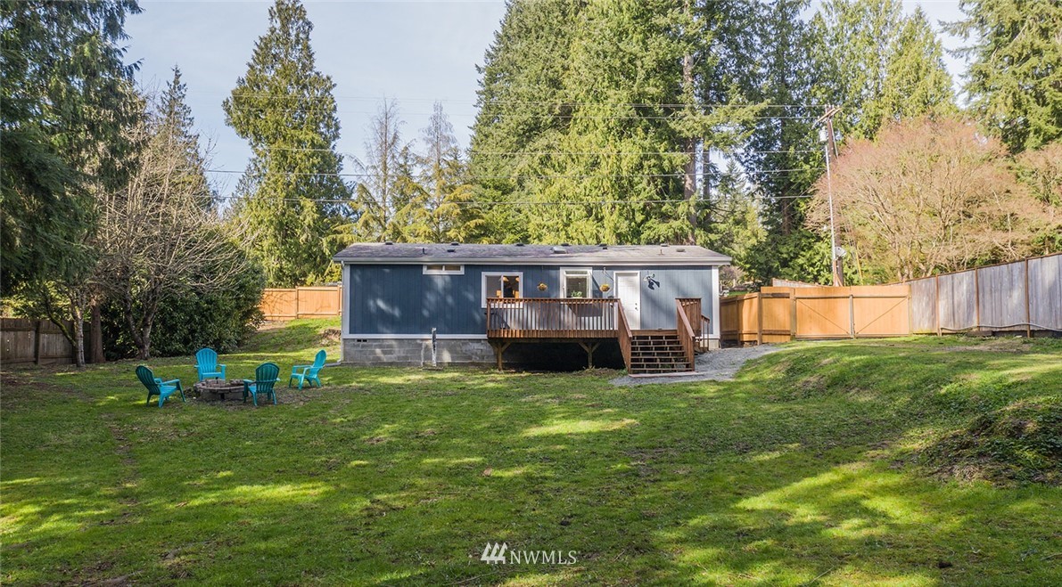 17920 Trombley Road Snohomish, WA 98290 - Photo 32 of 36 a view of a house with a yard and sitting area