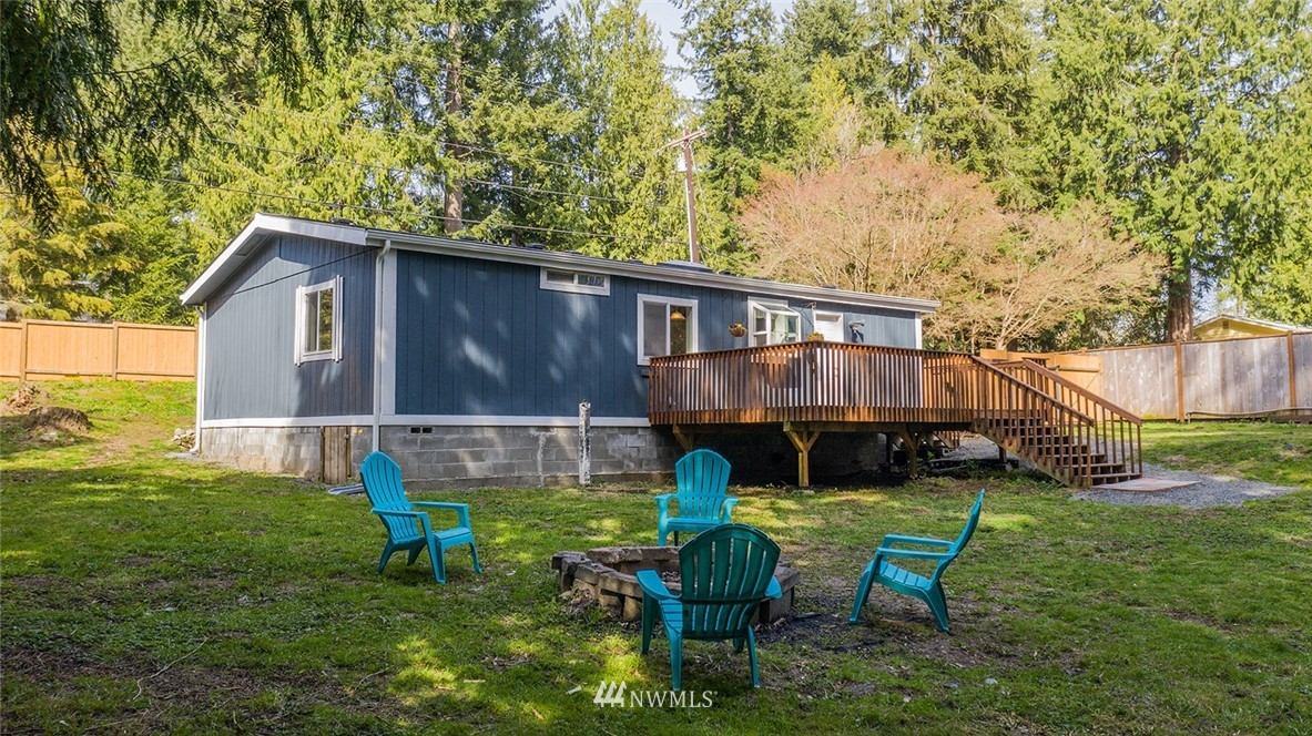 17920 Trombley Road Snohomish, WA 98290 - Photo 33 of 36 a view of a chair and table in backyard of the house