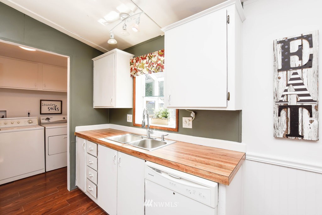 17920 Trombley Road Snohomish, WA 98290 - Photo 9 of 36 a utility room with cabinets washer and dryer
