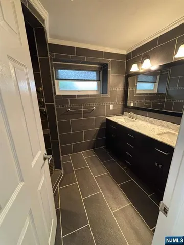 a bathroom with a sink and a shower
