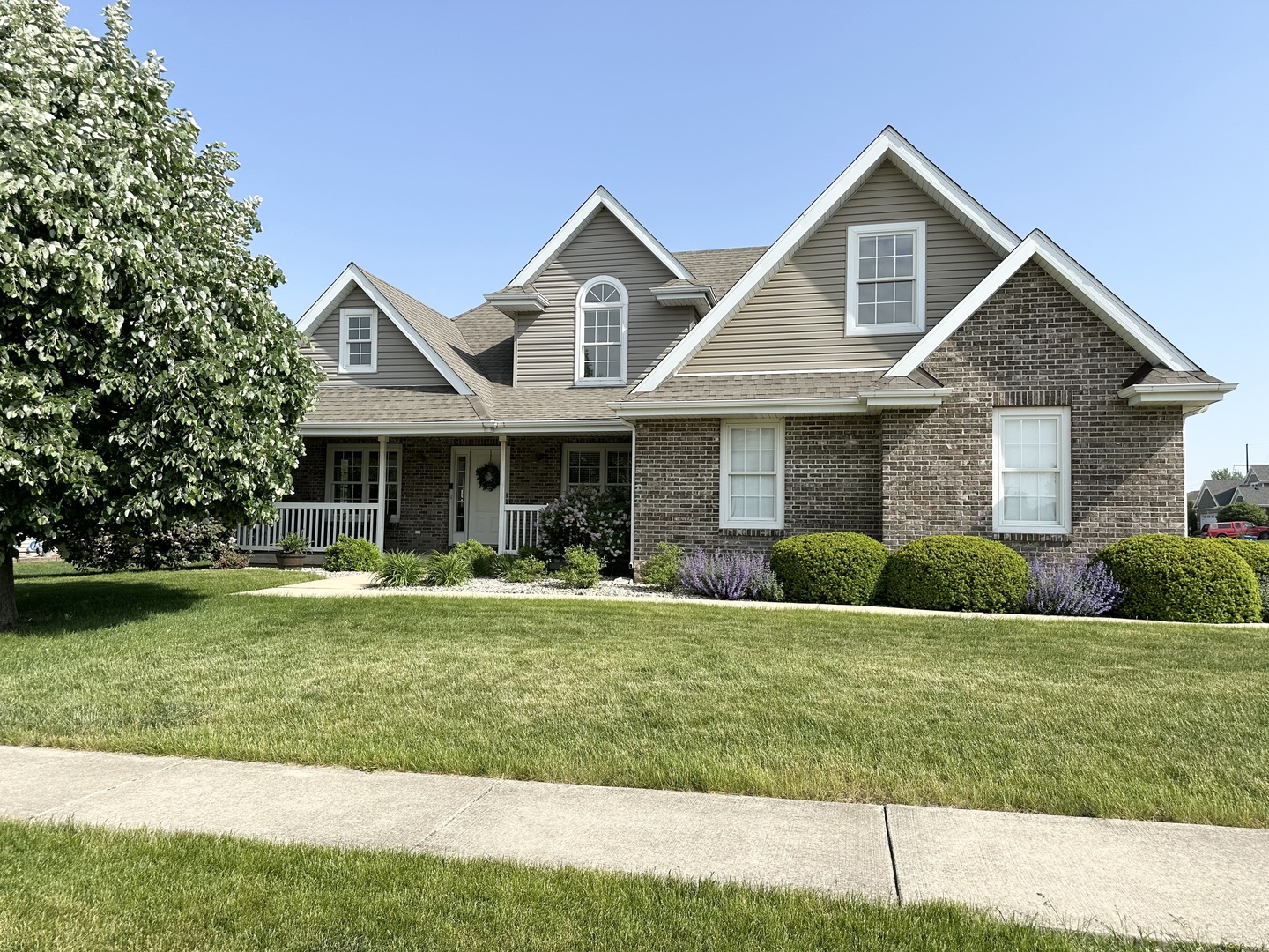 a front view of a house with a yard