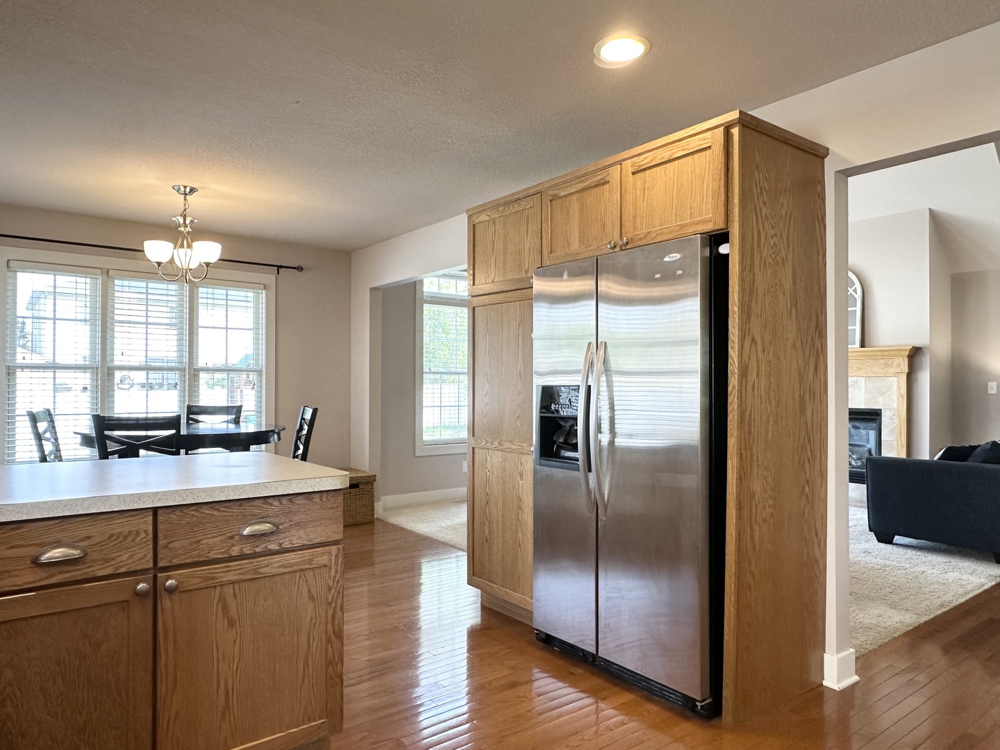 1205 Eagle Bluff Drive Bourbonnais, IL 60914 - Photo 11 of 51 a kitchen with stainless steel appliances granite countertop a refrigerator a sink and a stove with wooden floor