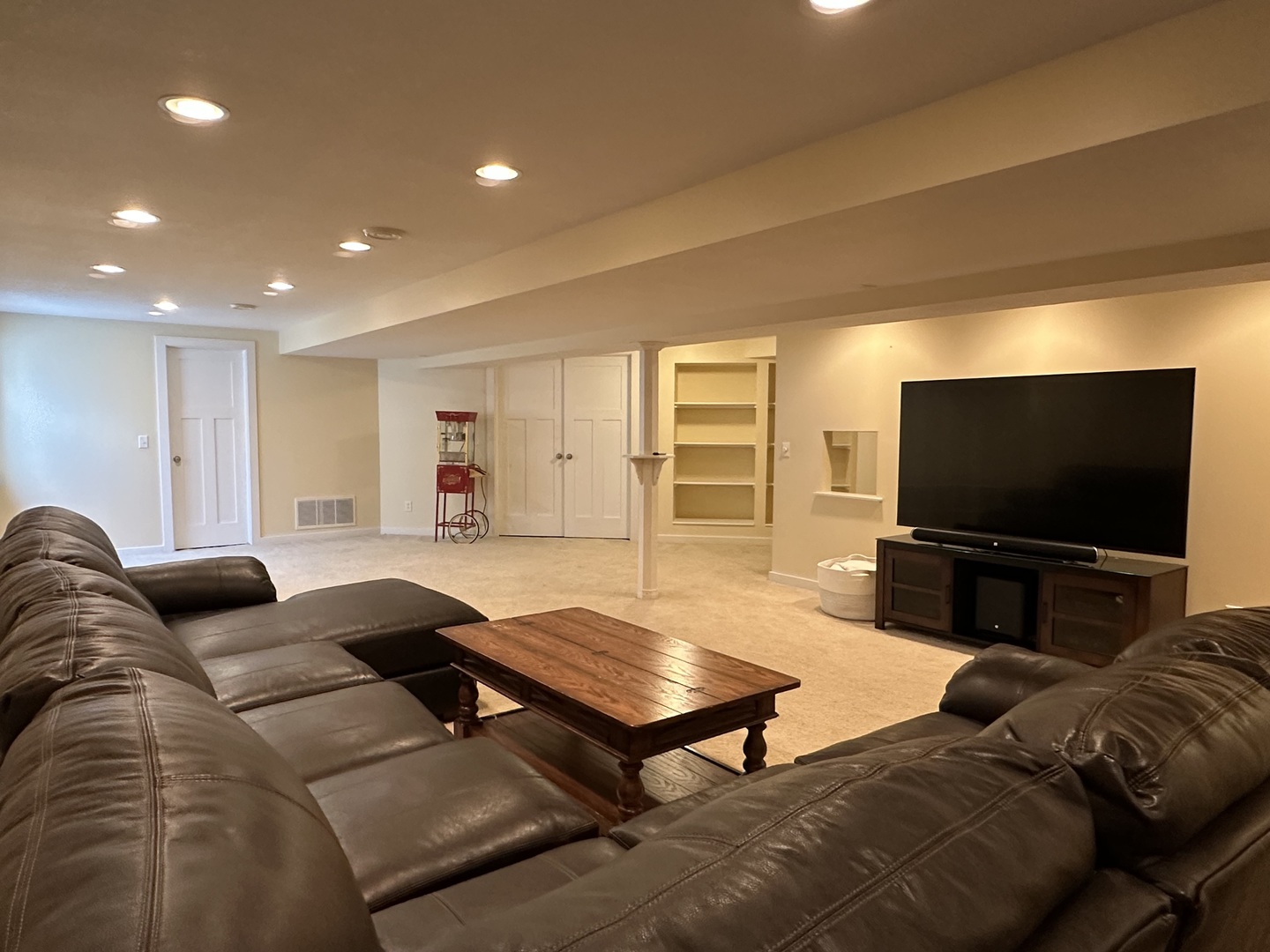 1205 Eagle Bluff Drive Bourbonnais, IL 60914 - Photo 34 of 51 a living room with furniture and a flat screen tv