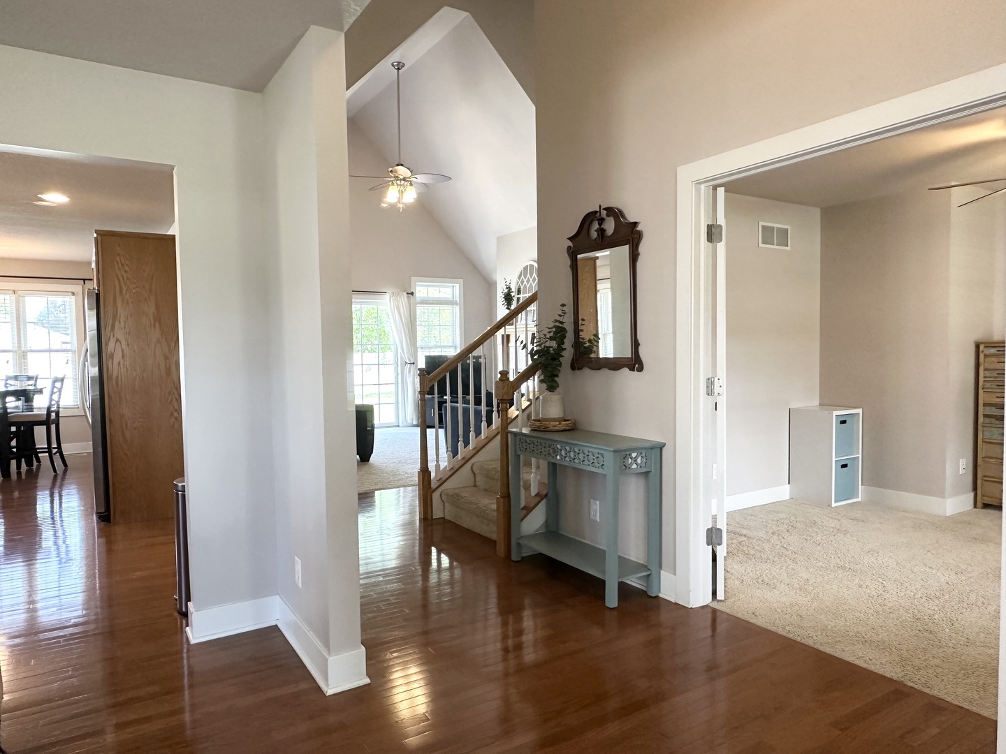1205 Eagle Bluff Drive Bourbonnais, IL 60914 - Photo 4 of 51 a hallway with wooden floor windows and stairs