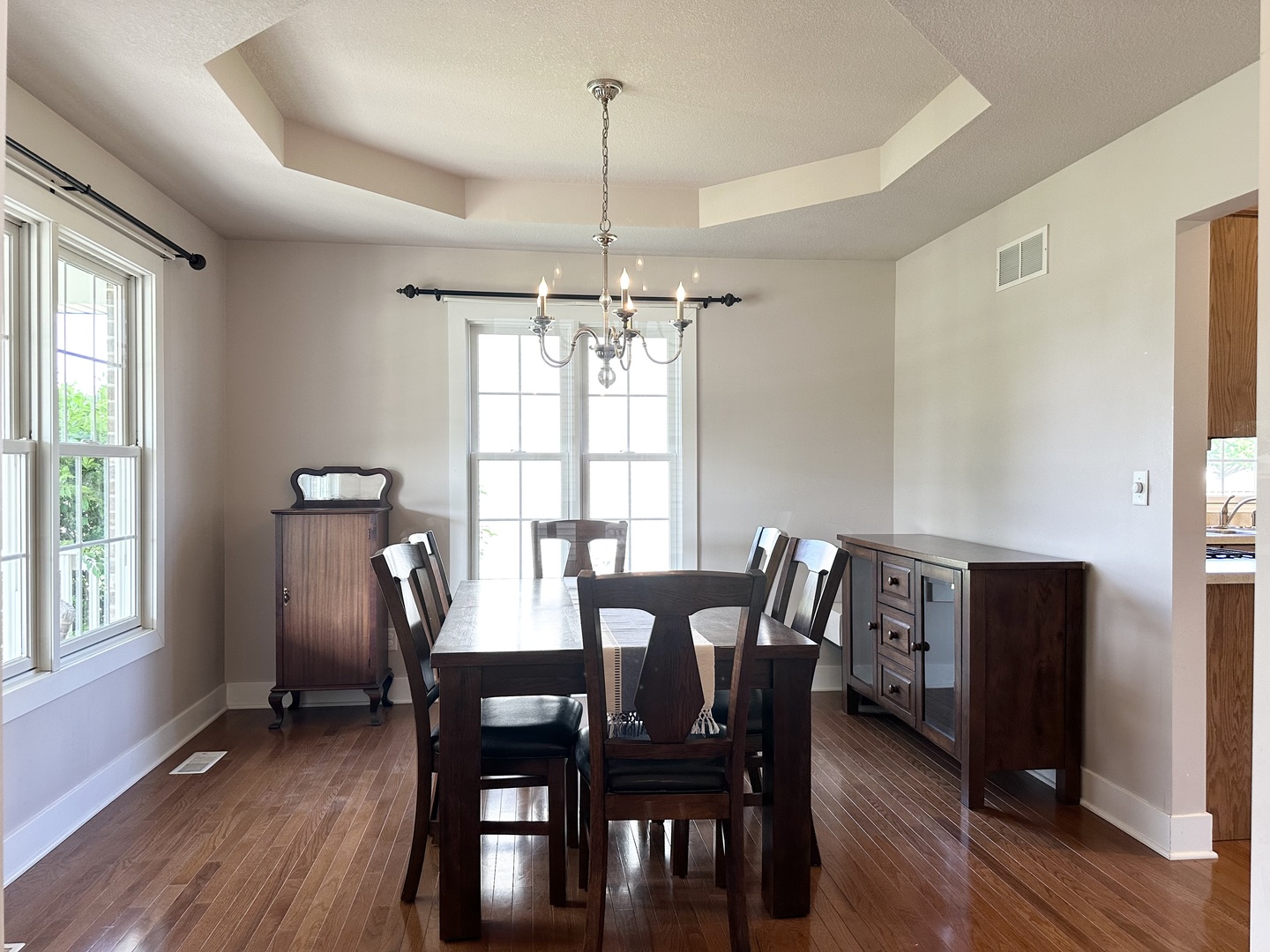 1205 Eagle Bluff Drive Bourbonnais, IL 60914 - Photo 7 of 51 a view of a dining room with furniture window and wooden floor