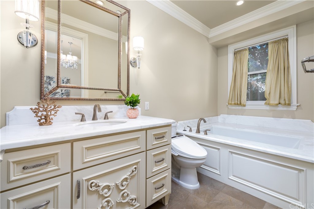 514 West Norman Avenue Arcadia, CA 91007 - Photo 19 of 69 a bathroom with a granite countertop toilet sink and mirror