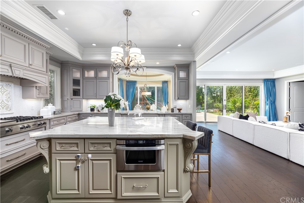 514 West Norman Avenue Arcadia, CA 91007 - Photo 25 of 69 a kitchen with kitchen island granite countertop a center island a stove cabinets a dining table and chairs