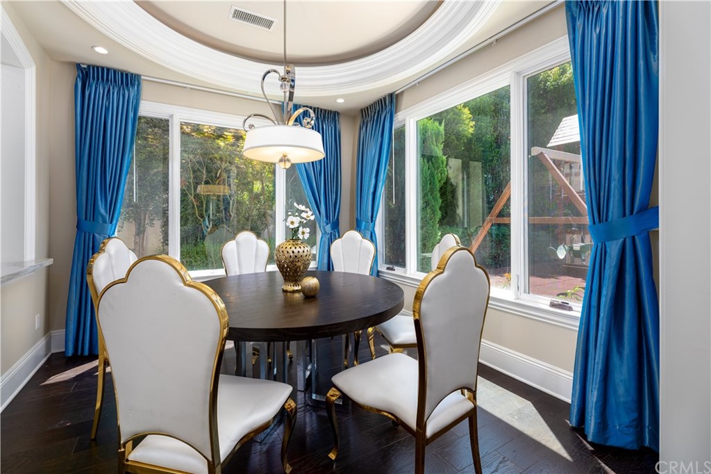 514 West Norman Avenue Arcadia, CA 91007 - Photo 31 of 69 a dining room with furniture a chandelier and wooden floor