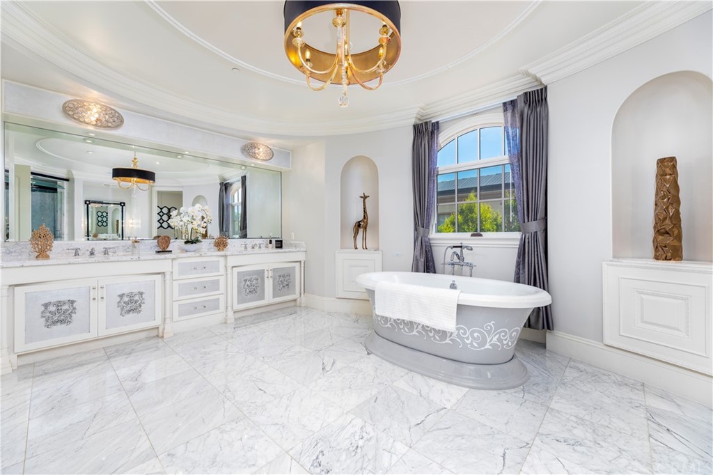 514 West Norman Avenue Arcadia, CA 91007 - Photo 47 of 69 a spacious bathroom with a double vanity sink a mirror and a bathtub