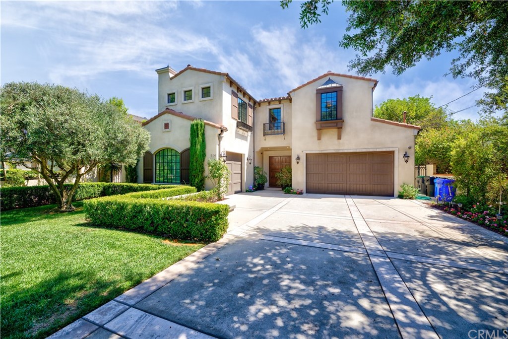 514 West Norman Avenue Arcadia, CA 91007 - Photo 6 of 69 a front view of a house with a yard and garage