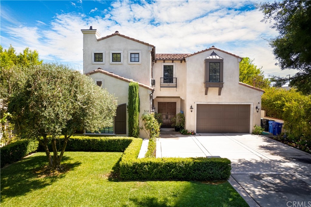 514 West Norman Avenue Arcadia, CA 91007 - Photo 63 of 69 a front view of a house with a yard and garage