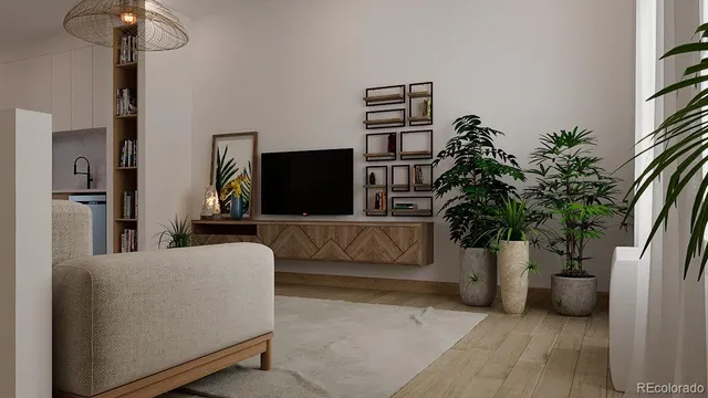 a living room with furniture and a potted plant