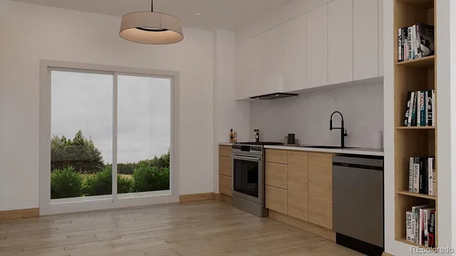 a kitchen with stainless steel appliances granite countertop a stove and a refrigerator