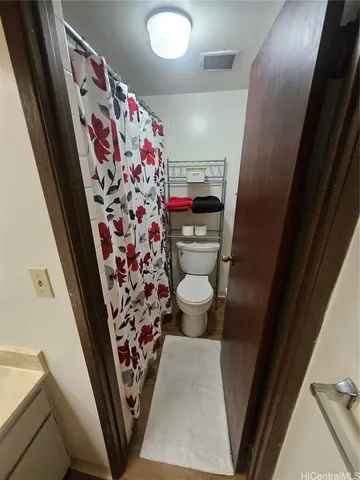 a view of room with window and hardwood floor