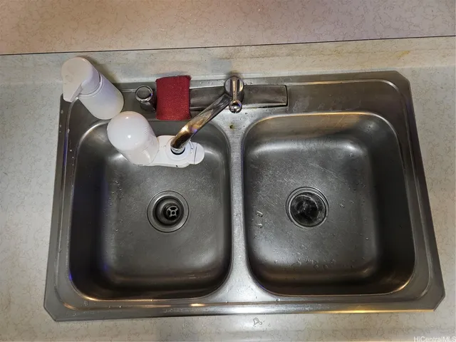 a bathroom with a sink and mirror