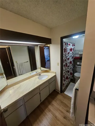 a view of balcony with wooden floor