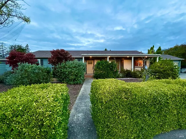 a view of house with garden