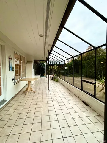 a view of an empty room with windows