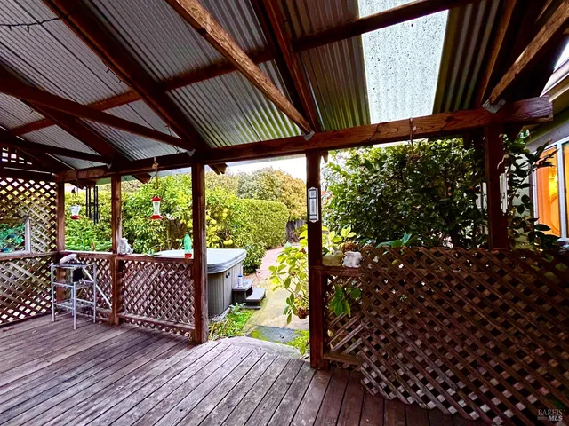 a view of a room with wooden floor and outdoor space