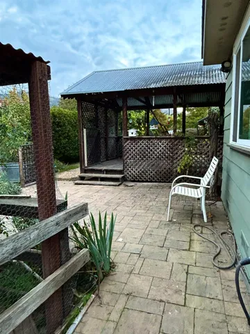 a patio with table and chairs