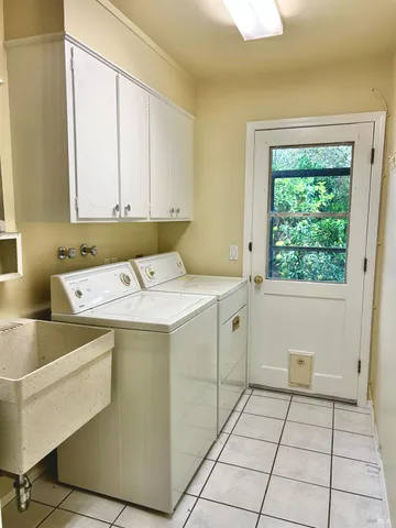 a utility room with washer and dryer