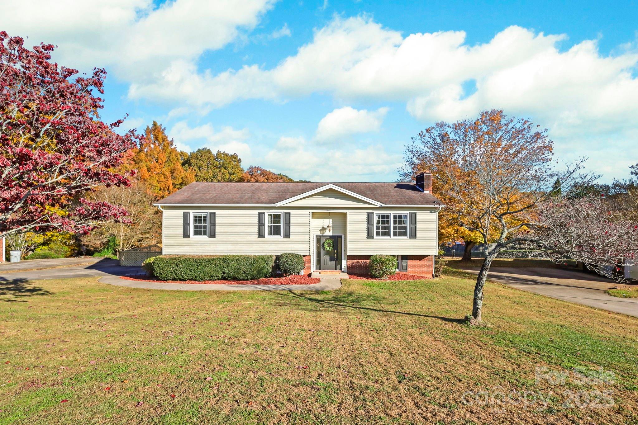 2216 Olde Well Road Hudson, NC 28638 - Photo 2 of 48 a front view of a house with a yard and garage