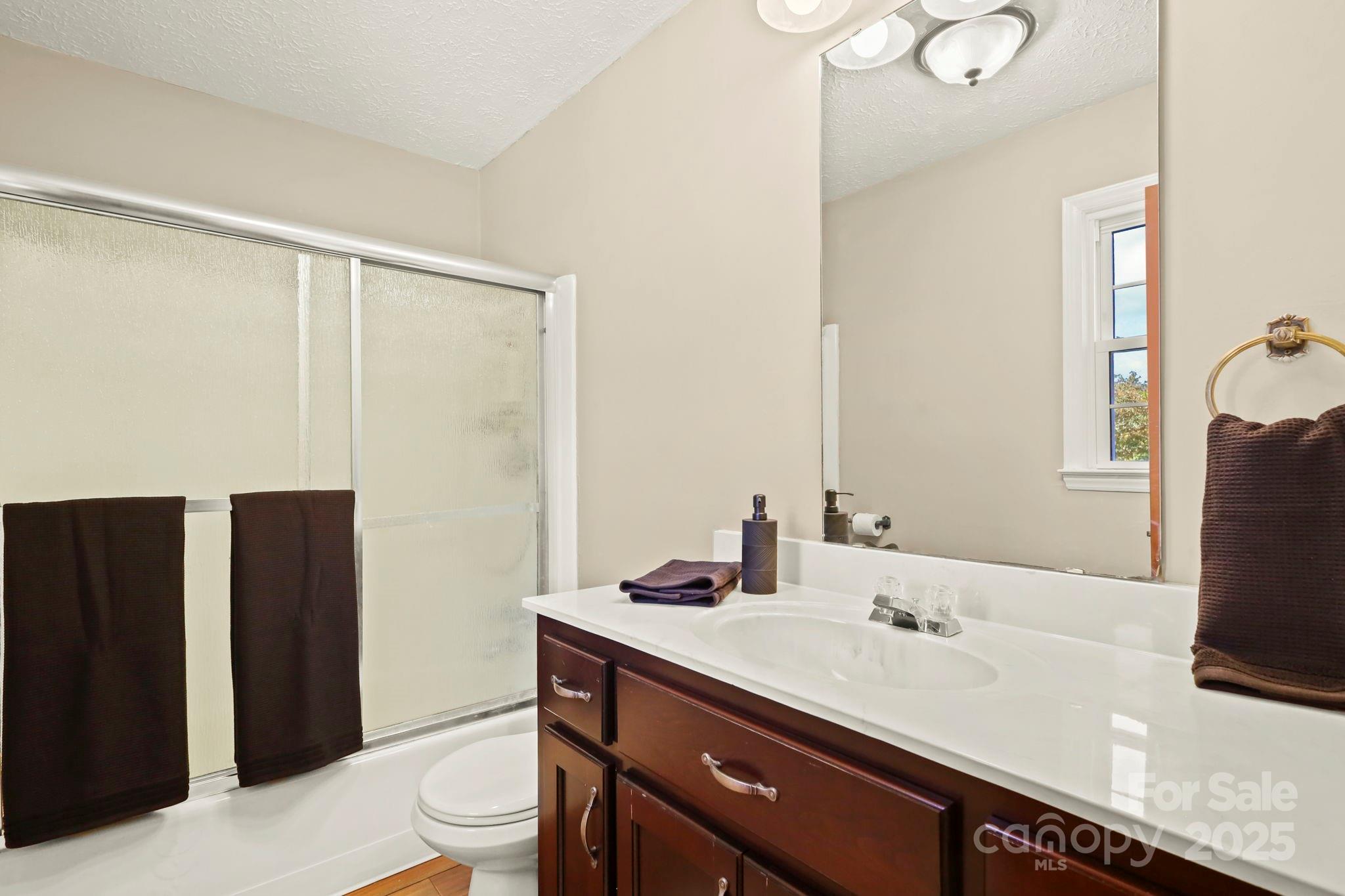 2216 Olde Well Road Hudson, NC 28638 - Photo 23 of 48 a bathroom with a sink and a mirror