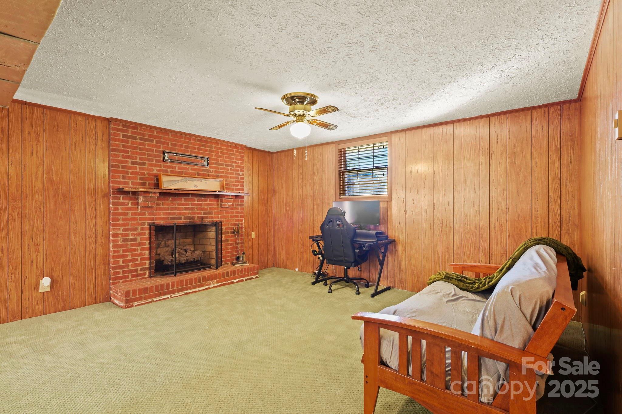 2216 Olde Well Road Hudson, NC 28638 - Photo 24 of 48 a living room with furniture and a fireplace