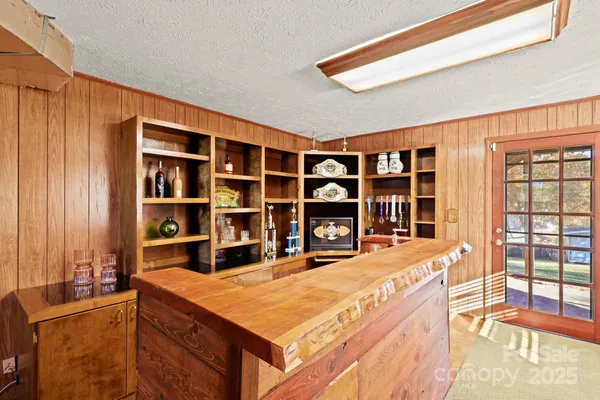 a view of an entryway with wooden floor and windows
