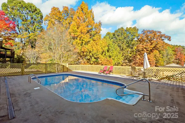 a view of a swimming pool with a lounge chairs