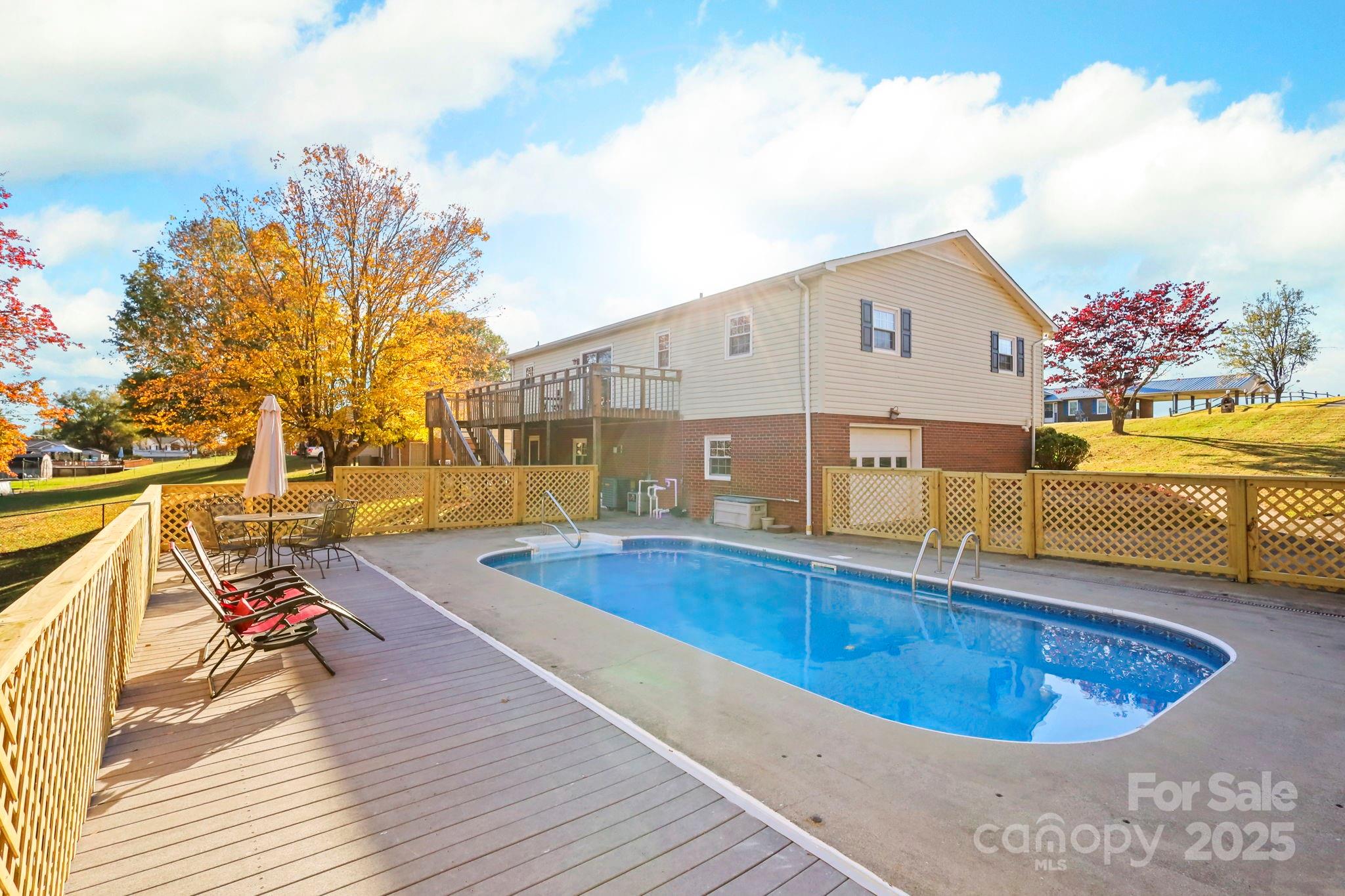 2216 Olde Well Road Hudson, NC 28638 - Photo 39 of 48 a view of a swimming pool with a lounge chairs