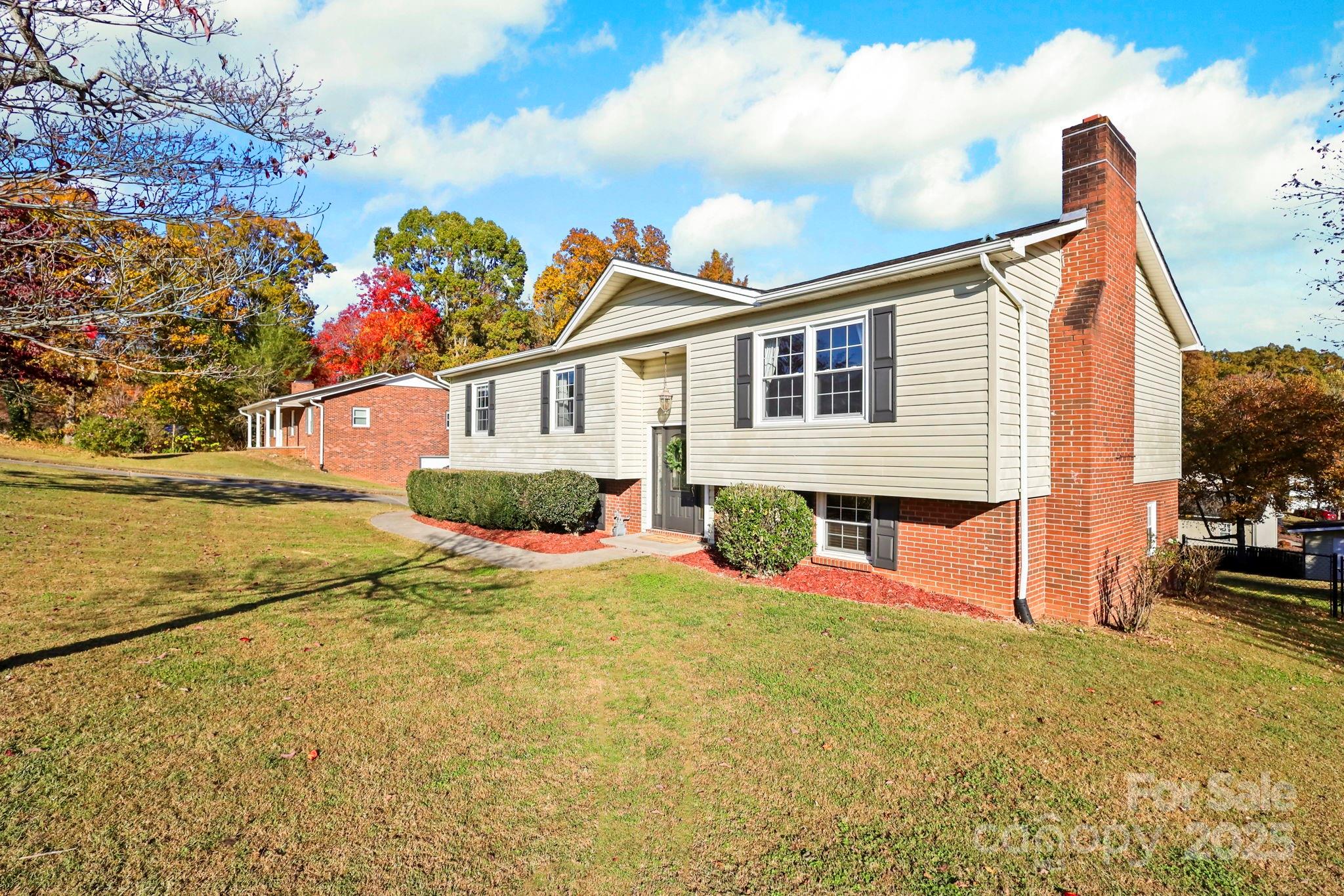 2216 Olde Well Road Hudson, NC 28638 - Photo 4 of 48 a front view of a house with an outdoor space