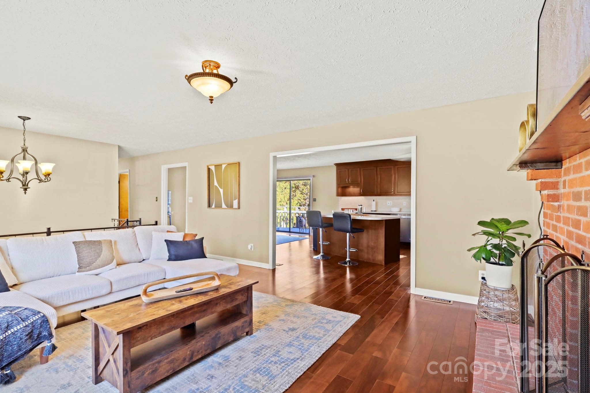 2216 Olde Well Road Hudson, NC 28638 - Photo 7 of 48 a living room with furniture and a flat screen tv