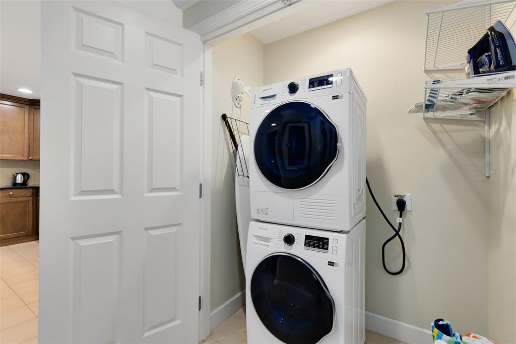 1360 Centre Ct Ridge Drive, Unit 201 Reunion, FL 34747 - Photo 20 of 29 a utility room with dryer and washer