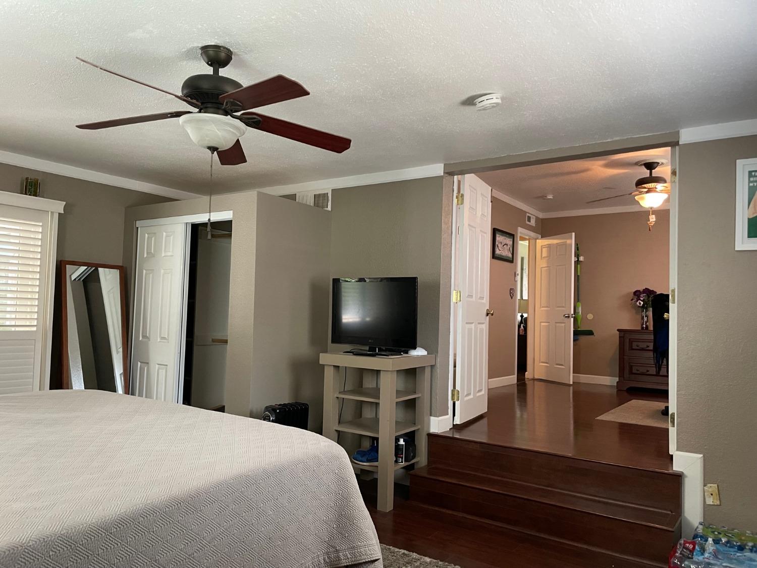 1606 Bay Meadows Drive Modesto, CA 95350 - Photo 17 of 20 a bedroom with a bed and a flat screen tv