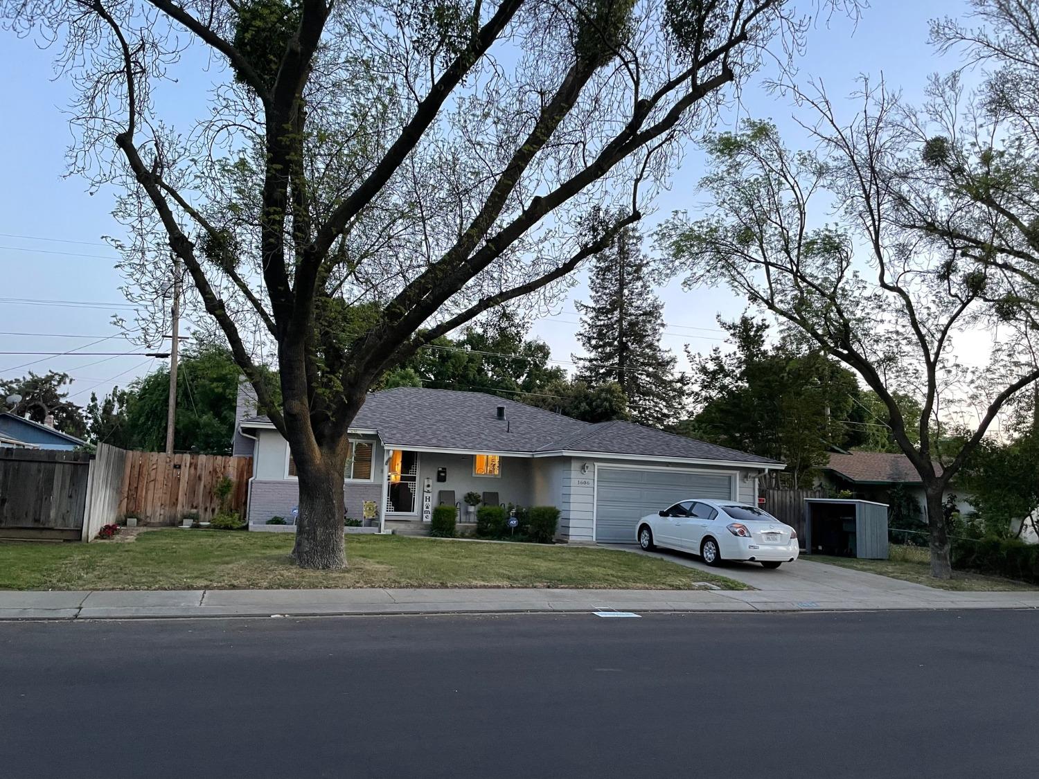 1606 Bay Meadows Drive Modesto, CA 95350 - Photo 2 of 20 a front view of house with yard and trees