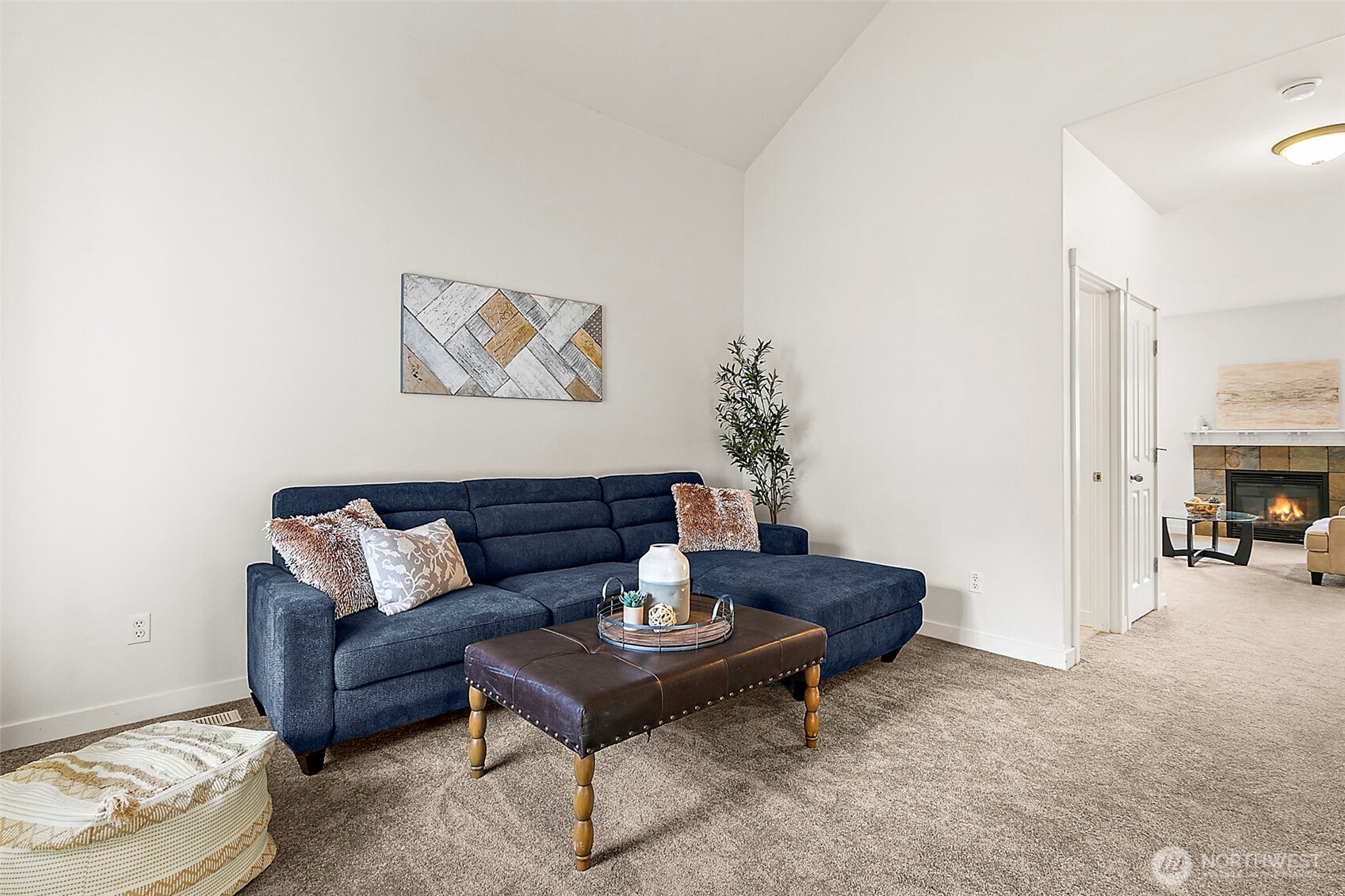 27729 257th Avenue Southeast Maple Valley, WA 98038 - Photo 18 of 40 a living room with furniture and a fireplace