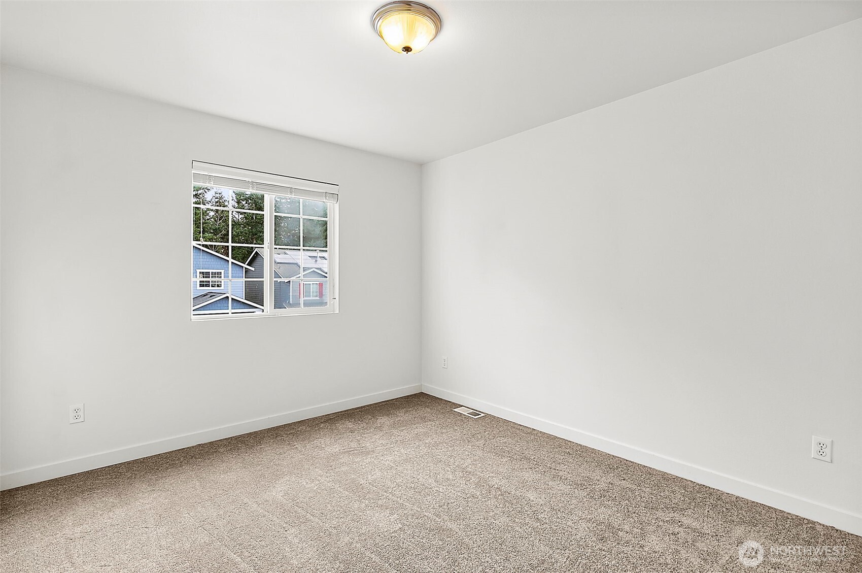 27729 257th Avenue Southeast Maple Valley, WA 98038 - Photo 20 of 40 an empty room with windows