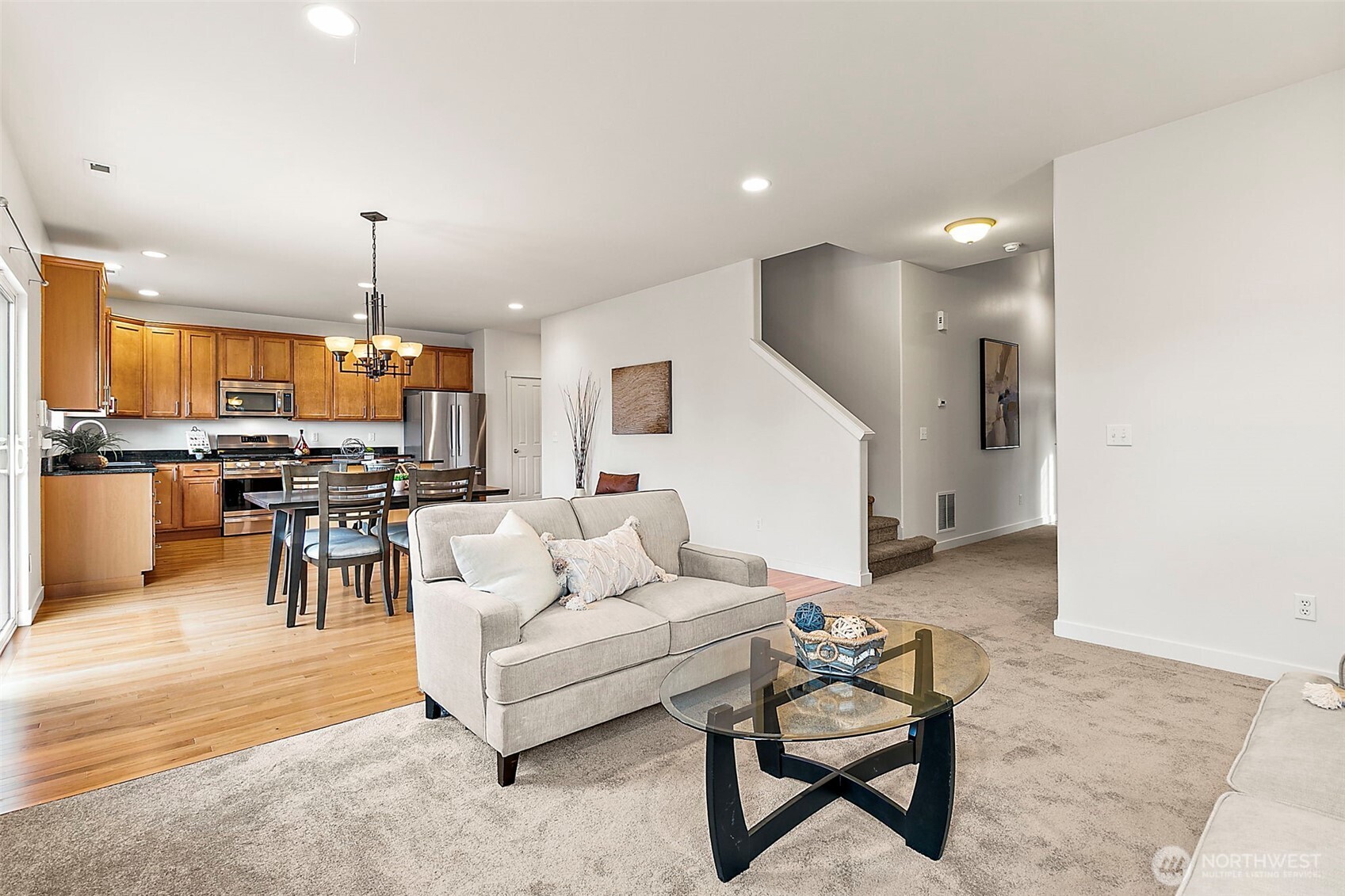 27729 257th Avenue Southeast Maple Valley, WA 98038 - Photo 3 of 40 a living room with furniture and kitchen view