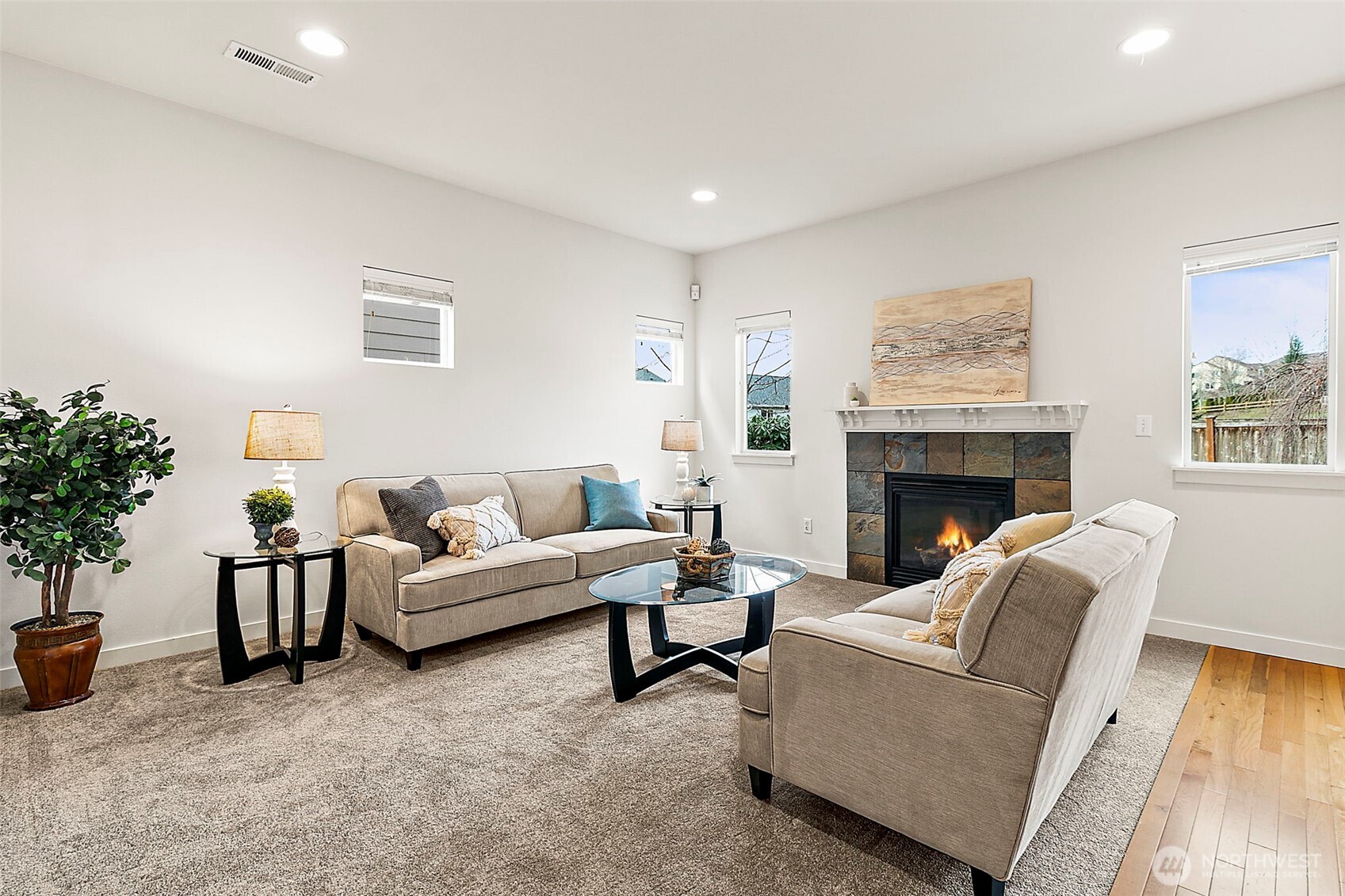 27729 257th Avenue Southeast Maple Valley, WA 98038 - Photo 4 of 40 a living room with furniture and a fireplace