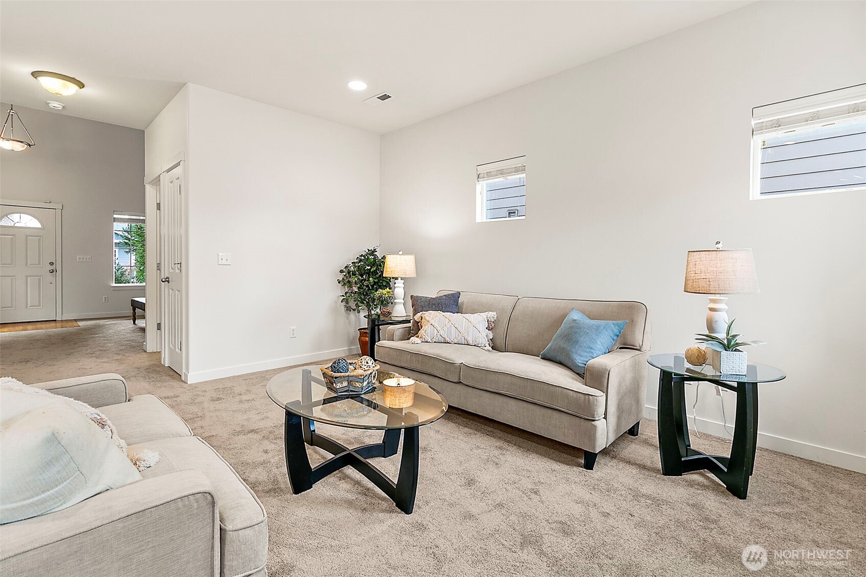 27729 257th Avenue Southeast Maple Valley, WA 98038 - Photo 6 of 40 a living room with furniture and a table