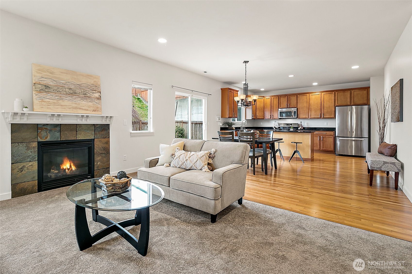 27729 257th Avenue Southeast Maple Valley, WA 98038 - Photo 7 of 40 a living room with fireplace furniture and a wooden floor