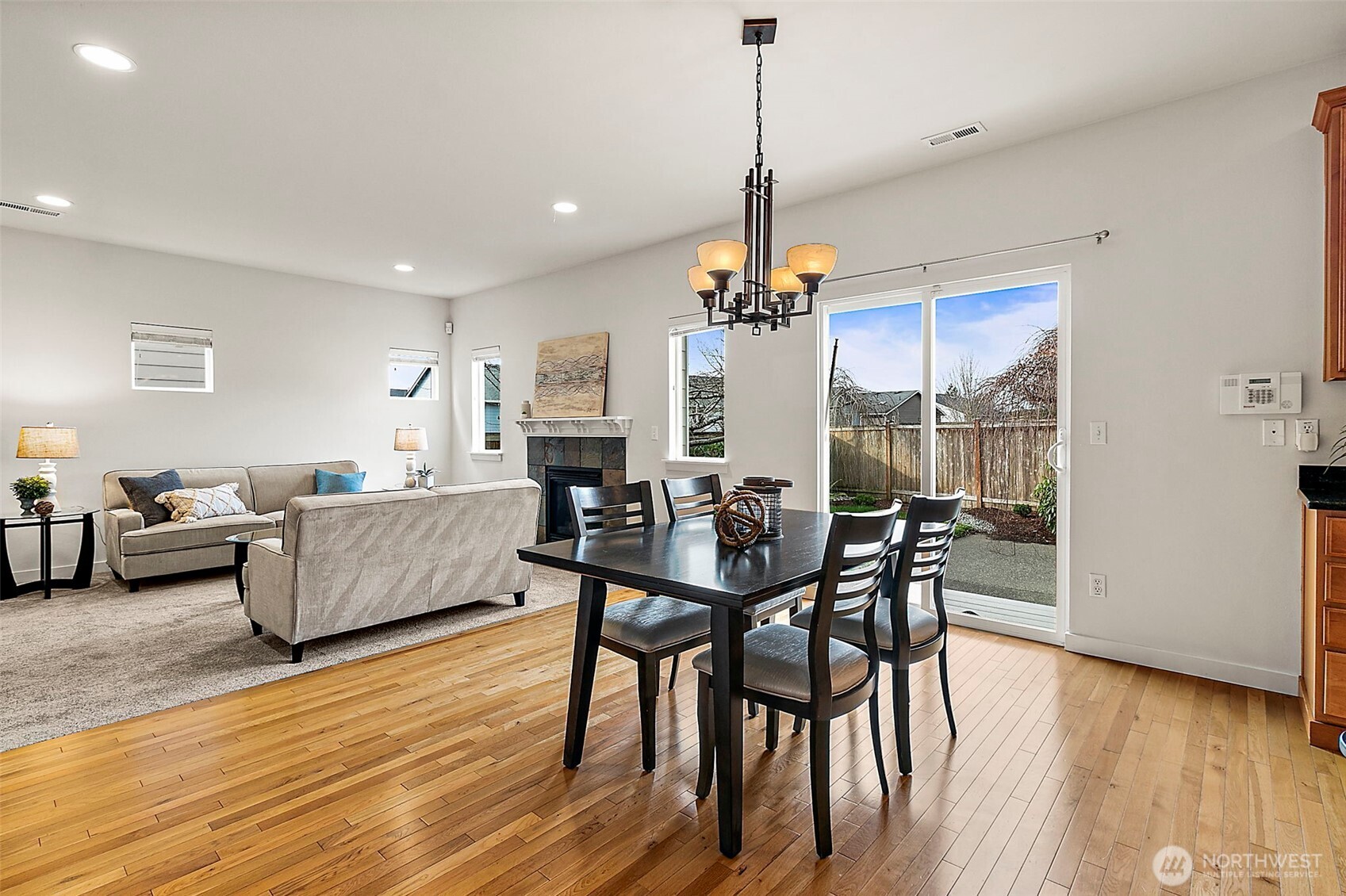 27729 257th Avenue Southeast Maple Valley, WA 98038 - Photo 10 of 40 a view of a dining room with furniture window and wooden floor