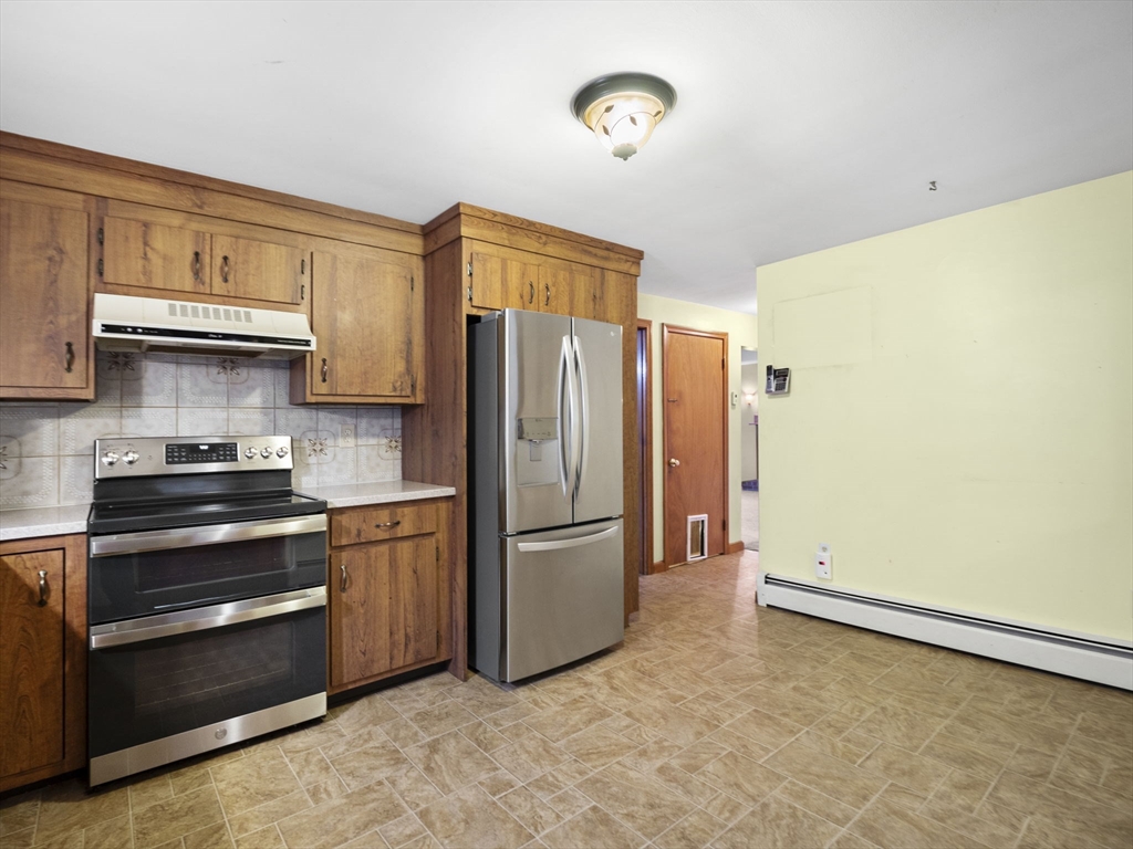 11 Dane Street Peabody, MA 01960 - Photo 13 of 27 a kitchen with a refrigerator stove and a sink