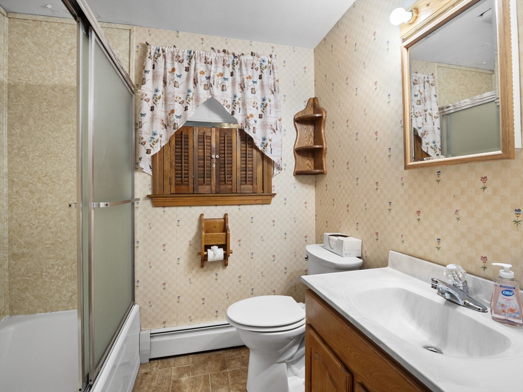 11 Dane Street Peabody, MA 01960 - Photo 7 of 27 a bathroom with a sink toilet and shower